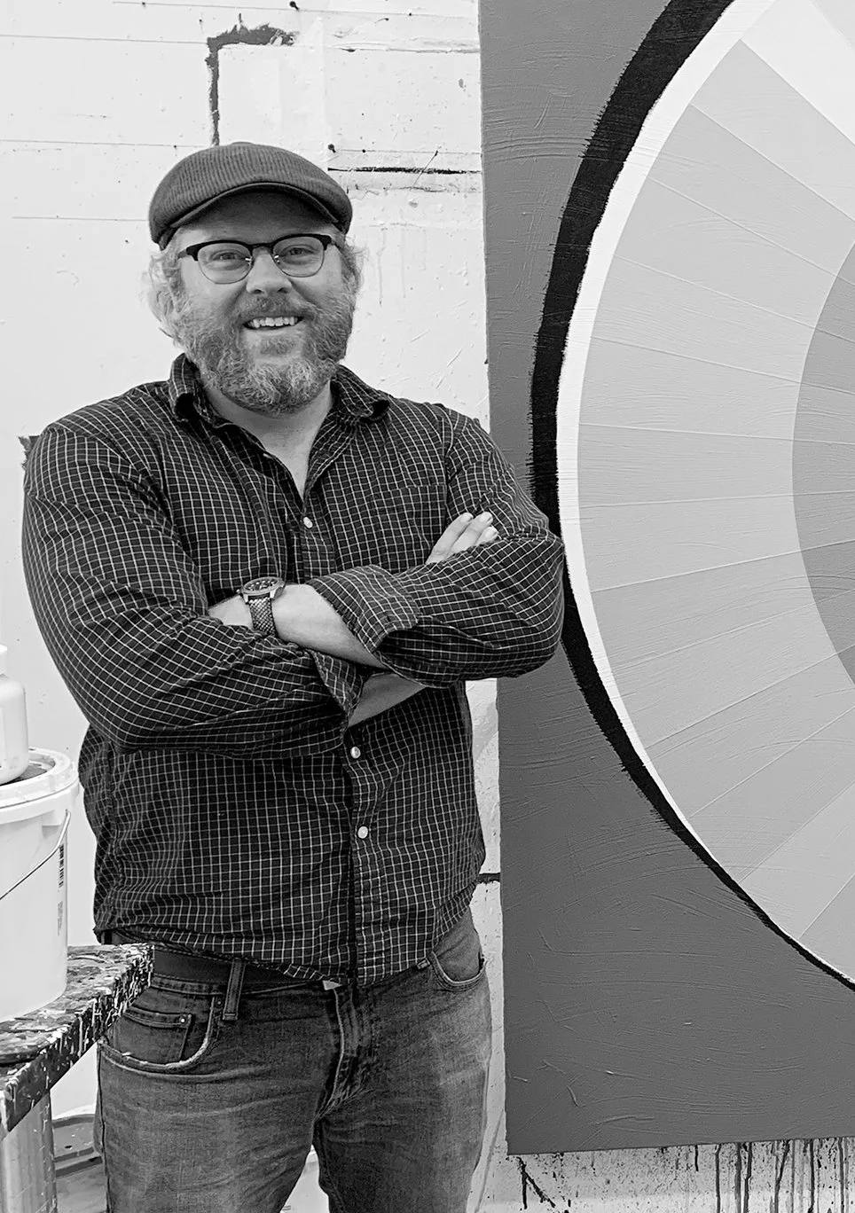 Damon Freed in front of one of his color wheel paintings